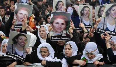 Pro-Kurdish demonstrators march with pictures of slain Kurdish activists during a protest in Istanbul